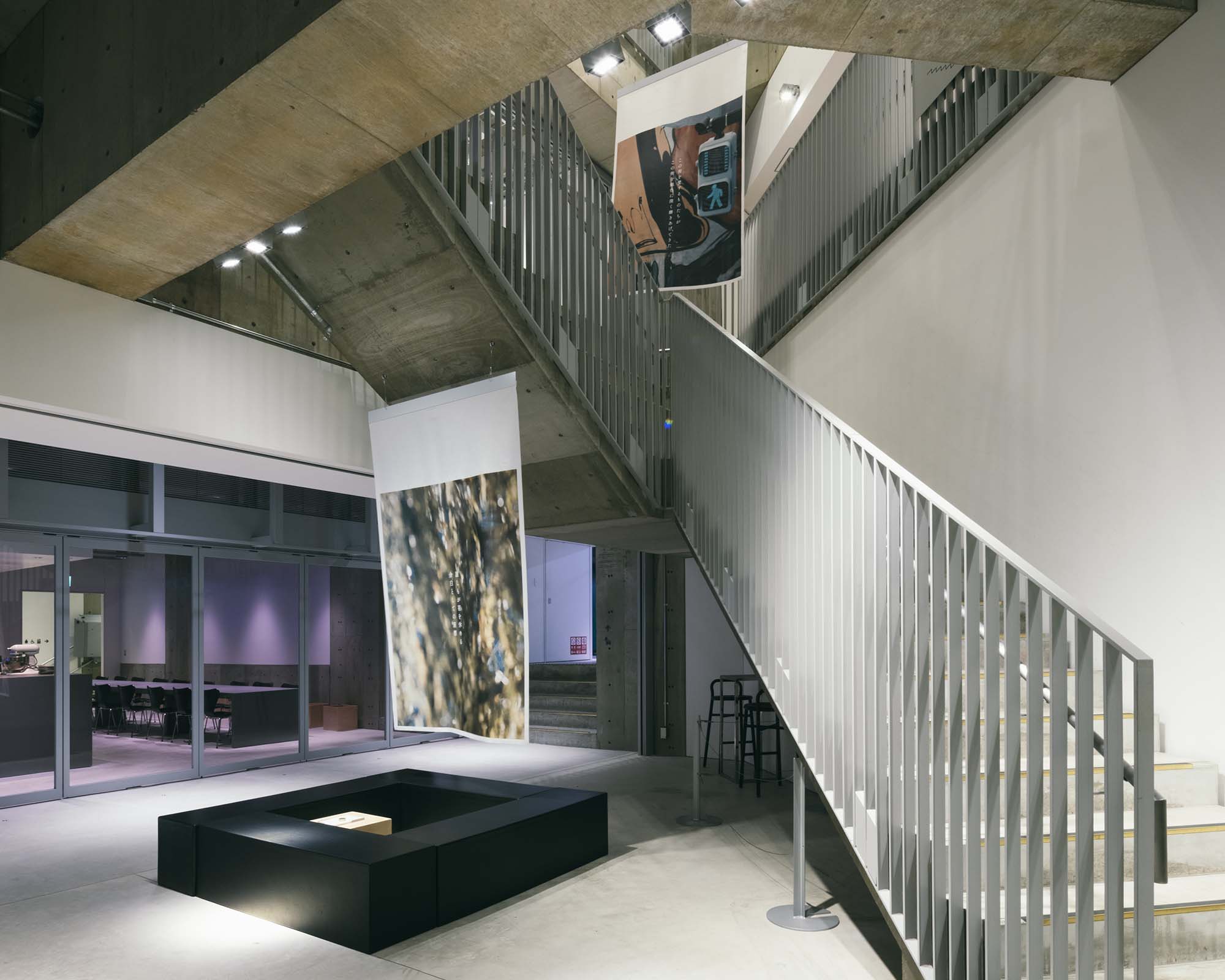 Photographic works suspended in the stair atrium on the B3 floor of Ginza Sony Park, appearing to float within the layered architectural space.