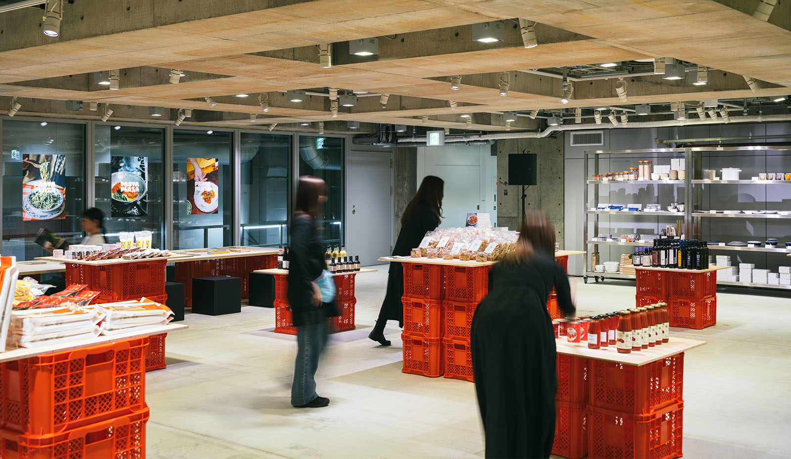 PASTA PLAZA at Ginza Sony Park, where food products are arranged on red crate displays and visitors browse the market-like setting.