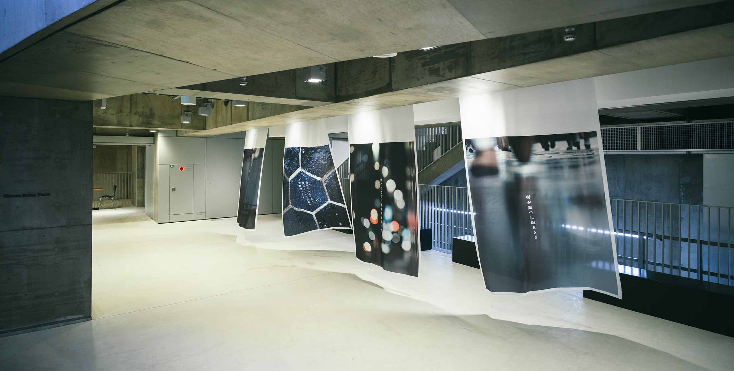 Large photographic works suspended on the B1 floor of Ginza Sony Park, gently swaying and capturing fragments of light and the city.